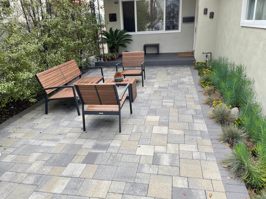 Paver courtyard with benches and planters