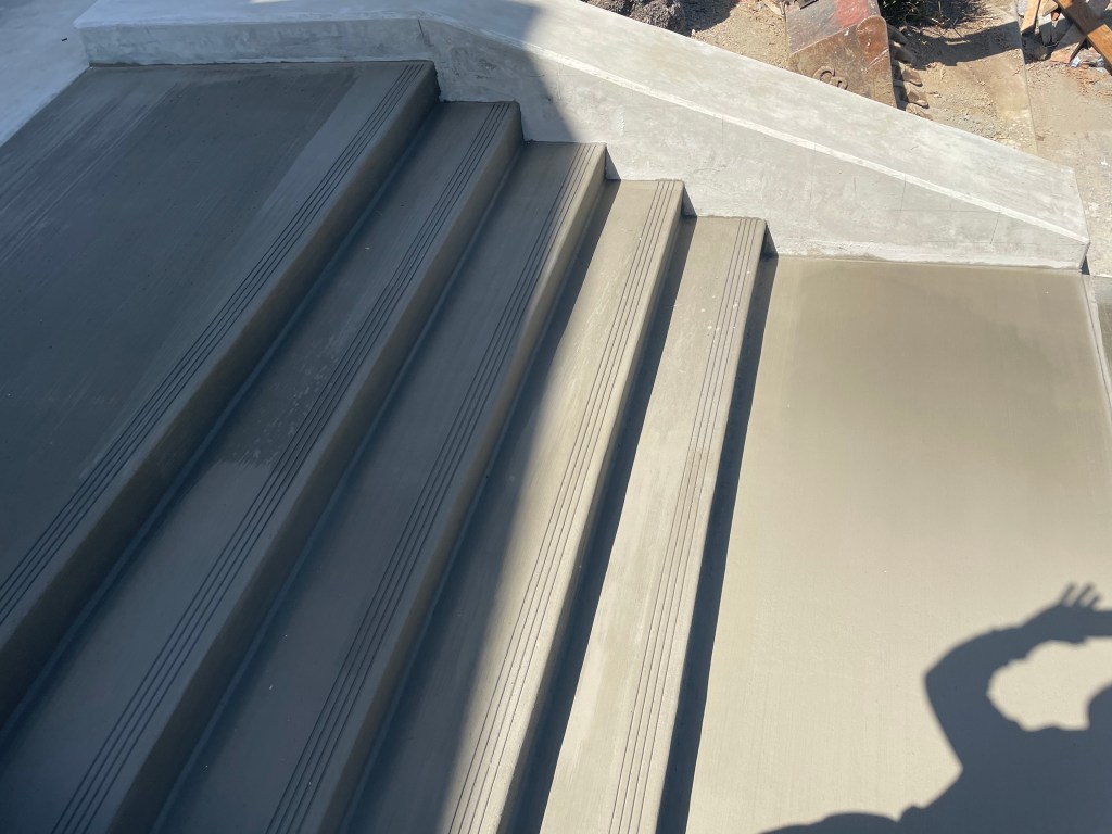 New concrete steps with a broom finish