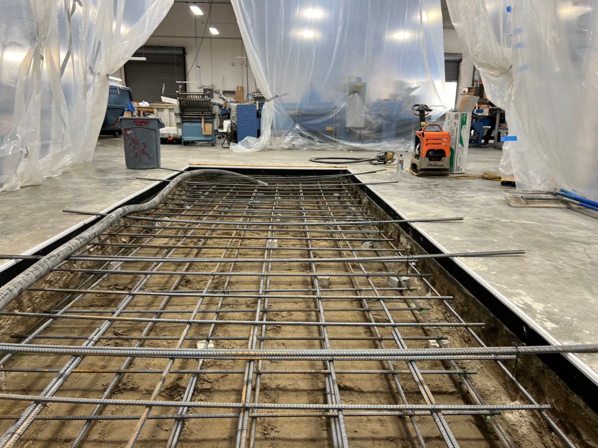 Rebar grid laid out for an indoor concrete slab pour